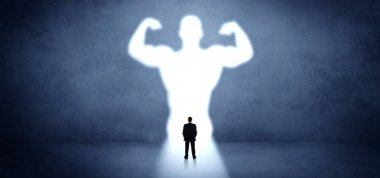 Businessman standing in front of a strong hero vision clipart