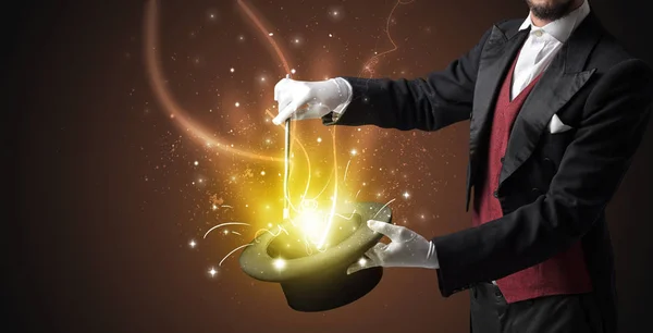 Magician hand conjure miracle from cylinder — Stock Photo, Image