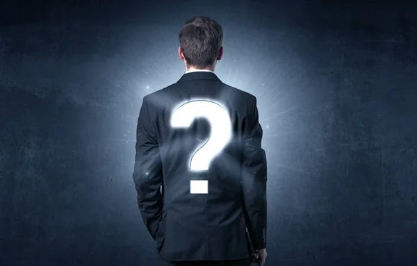 Man standing with question mark on his back — Stock Photo, Image