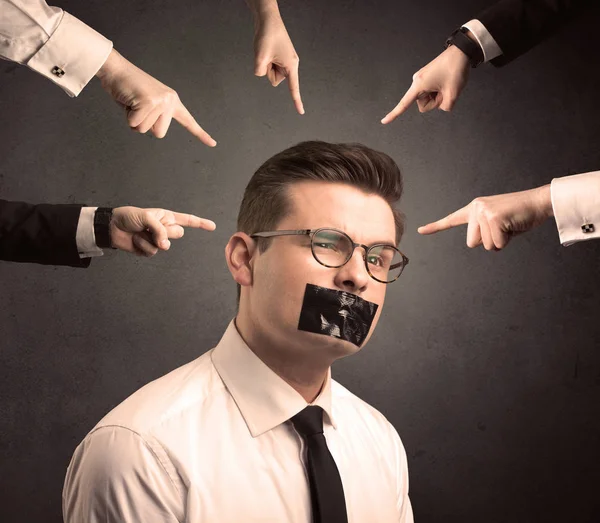 Multiple hands pointing at business employee — Stock Photo, Image