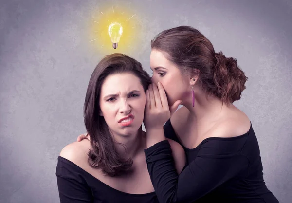 Girl telling secret things to her girlfriend — Stock Photo, Image