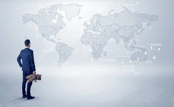 Man looking at map with objects in his hand — Stock Photo, Image