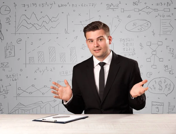 Businessman sitting at a desk — Stock Photo, Image