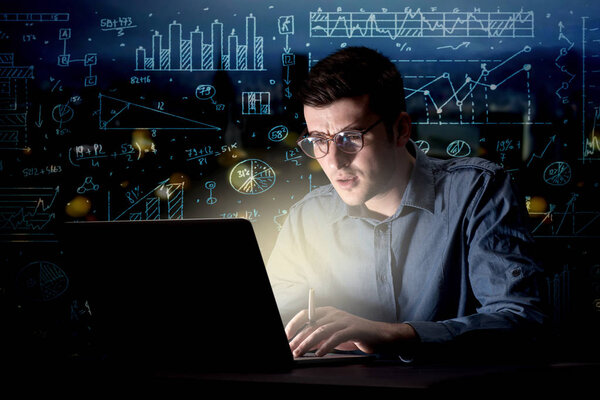 Businessman in the office at night