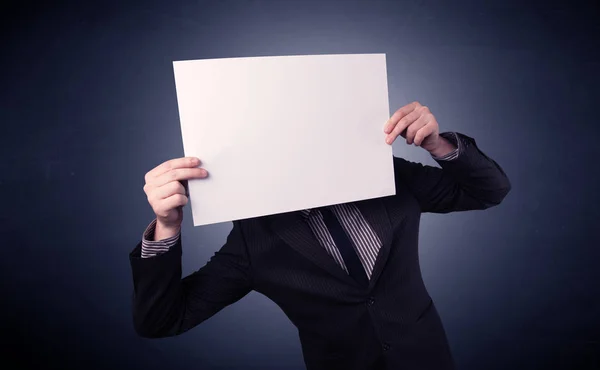 Businessman holding blank paper — Stock Photo, Image