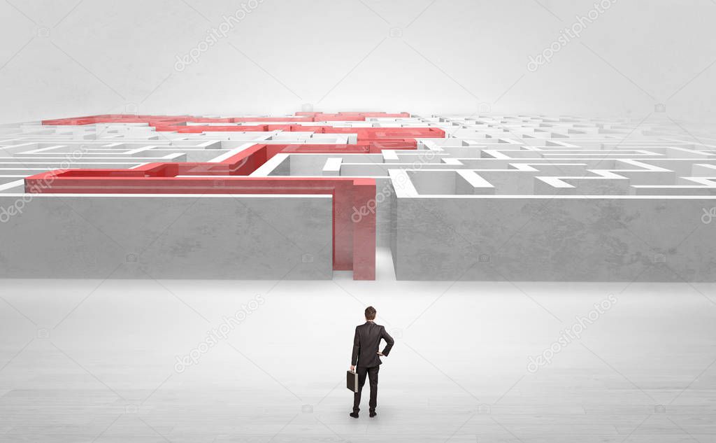 Businessman starting a stated labyrinth