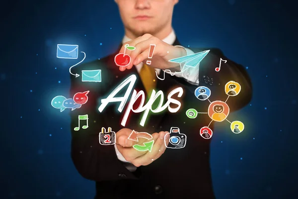 Businessman holding apps — Stock Photo, Image
