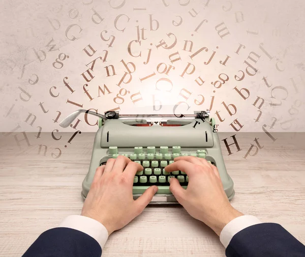 First person perspective elegant hand typing with flying letters concept — Stock Photo, Image