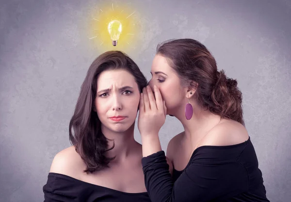 Girl telling secret things to her girlfriend — Stock Photo, Image