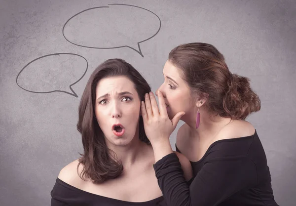 Girl telling secret things to her girlfriend — Stock Photo, Image