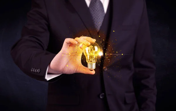 office worker holding a light bulb