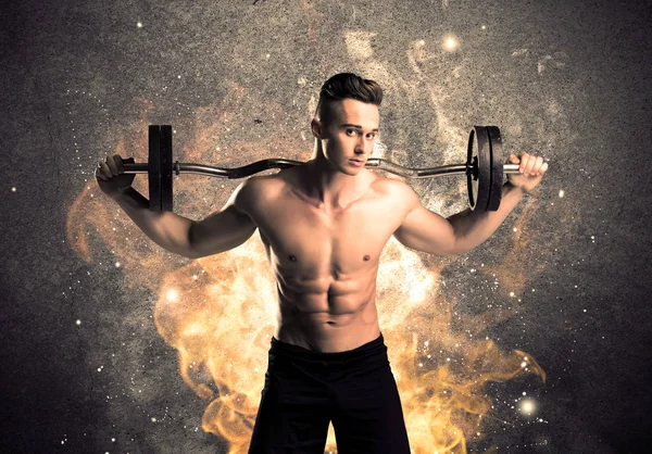 Healthy hot male showing muscles with fire — Stock Photo, Image