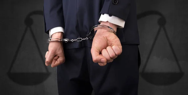 Arrested man with balance on the background — Stock Photo, Image