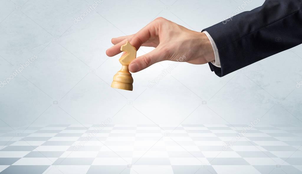 Big hand taking his next step on chess game