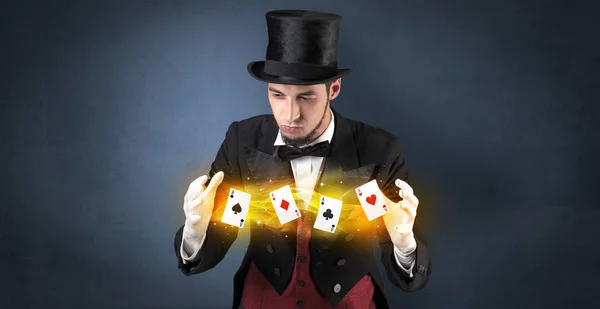 Illusionist making trick with magical play cards — Stock Photo, Image