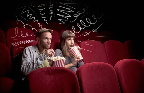 Cute couple in cinema watching movie — Stock Photo, Image
