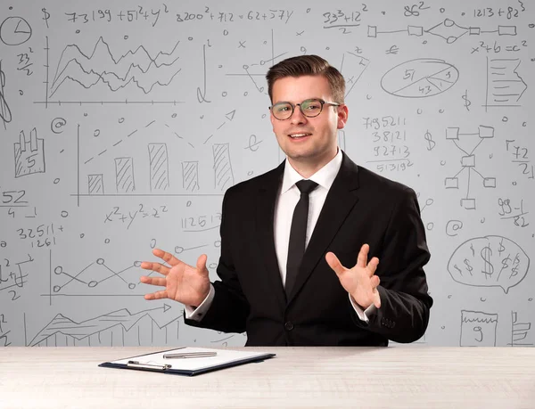 Businessman sitting at a desk — Stock Photo, Image