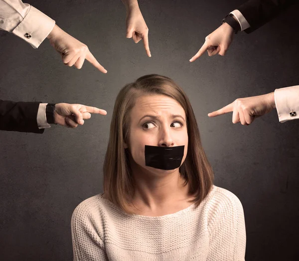 Multiple hands pointing at woman — Stock Photo, Image