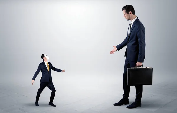 Conflict between small and big businessman — Stock Photo, Image