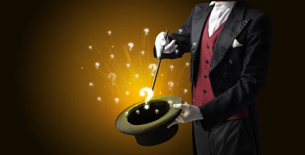 Magician conjure question signs from a cylinder — Stock Photo, Image