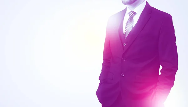 Young businessman standing and thinking — Stock Photo, Image