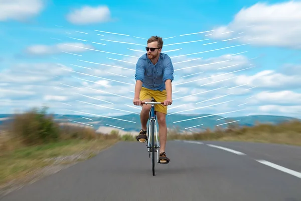 Casual cyclist riding bicycle very fast — Stock Photo, Image