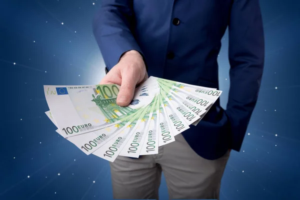 Zakenman bedrijf geld — Stockfoto