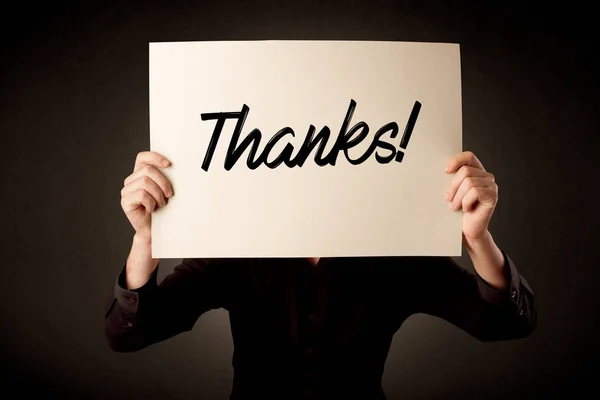 Empresario sosteniendo papel expresando gratitud —  Fotos de Stock