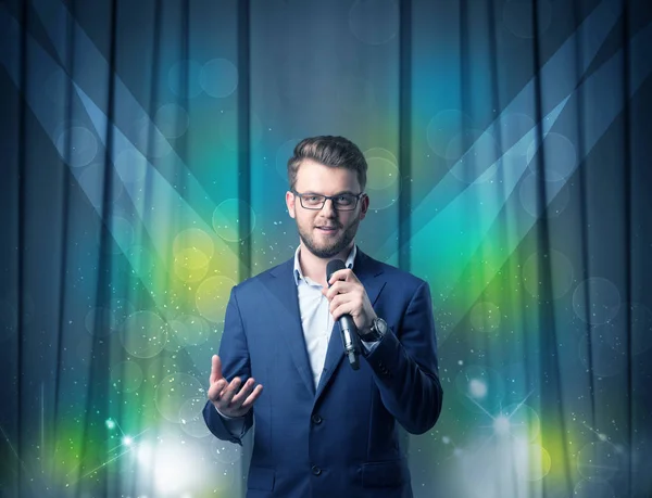 Businessman holding microphone — Stock Photo, Image