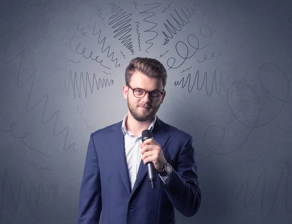 Businessman holding microphone — Stock Photo, Image