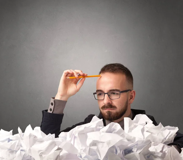 Businessman behind crumpled paper — Stock Photo, Image