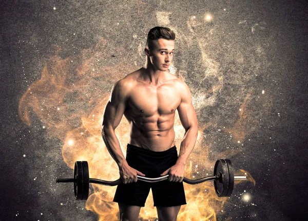 Healthy hot male showing muscles with fire — Stock Photo, Image