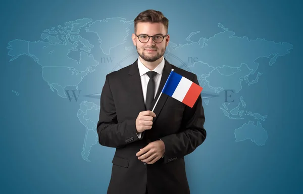 Man standing with flag and map background — Stock Photo, Image