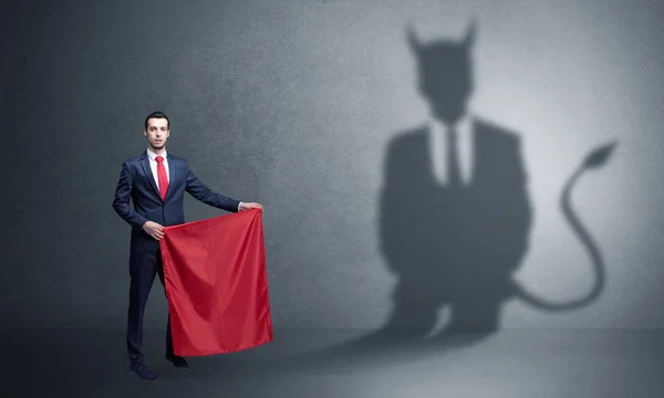 Zakenman met schaduw en toreador concept van de duivel — Stockfoto