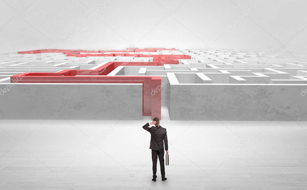 Businessman starting a stated labyrinth