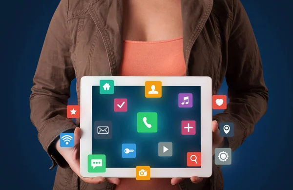 Woman holding tablet with multimedia graphics — Stock Photo, Image