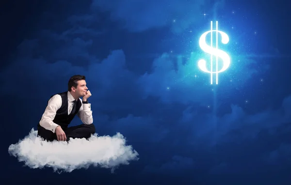 Man sitting on a cloud dreaming of money — Stock Photo, Image