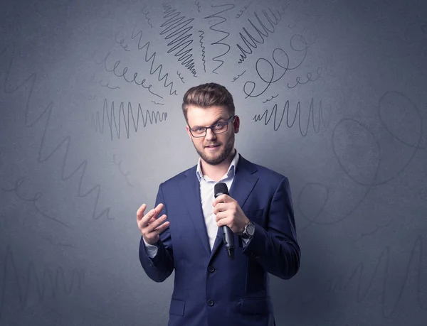 Businessman holding microphone — Stock Photo, Image