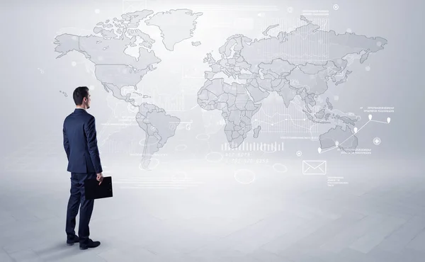 Man looking at map with objects in his hand — Stock Photo, Image