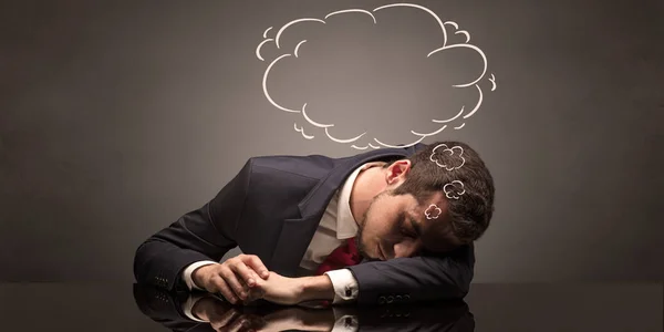 Businessman sleeping and dreaming at his workplace — Stock Photo, Image