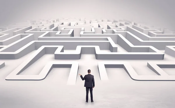 Businessman starting a flat 3d labyrinth — Stock Photo, Image