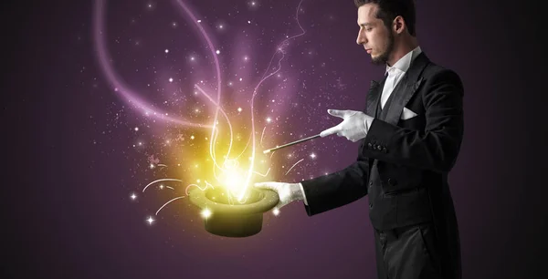 Magician hand conjure miracle from cylinder — Stock Photo, Image