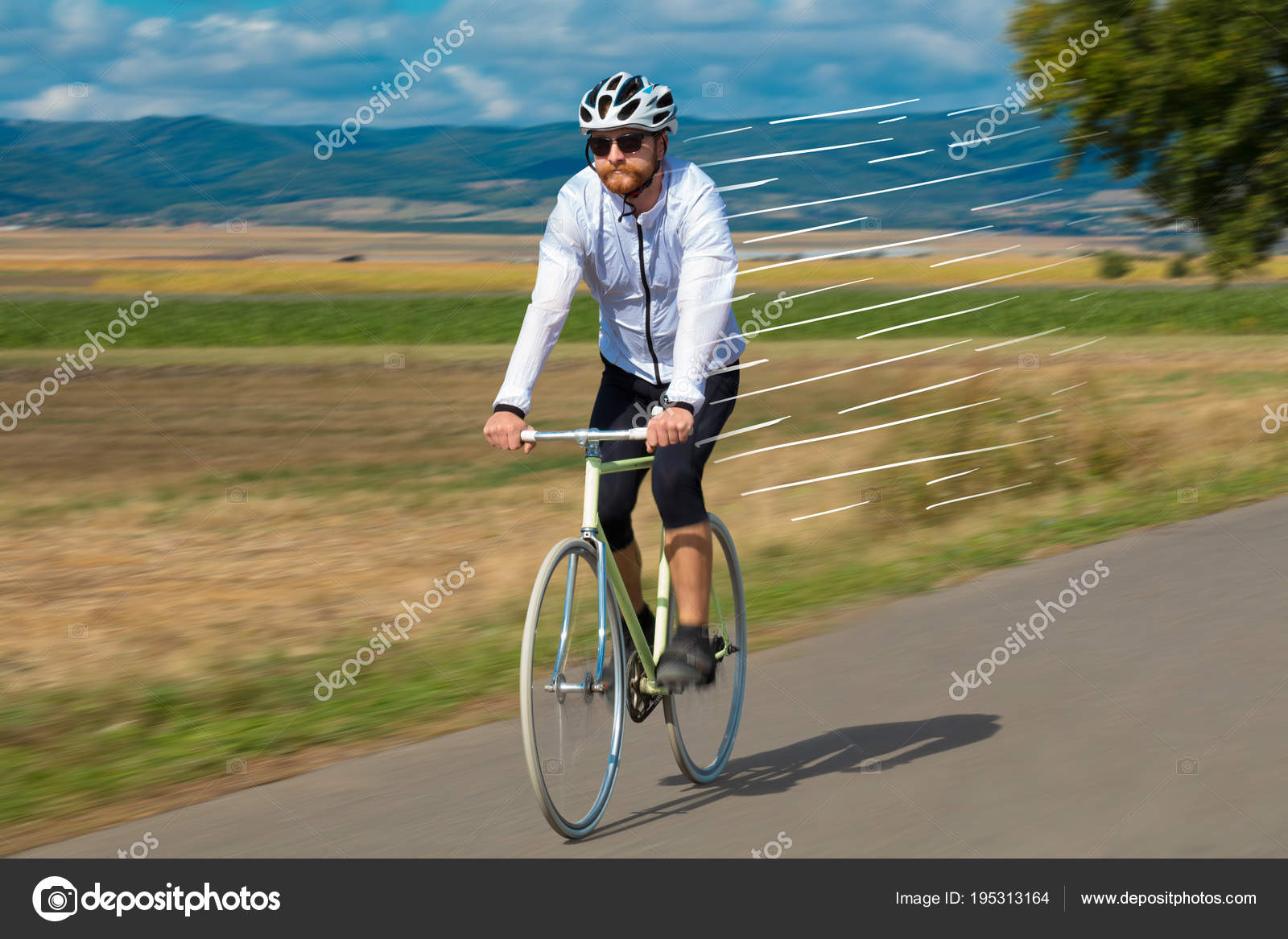 Casual cyclist riding bicycle very fast Stock Photo by ra2studio
