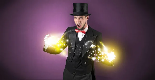 Magician holding his power on his hand — Stock Photo, Image