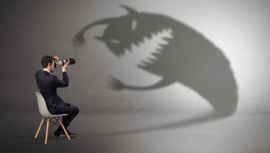 Businessman negotiate with a monster shadow clipart