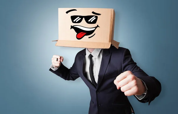 Young boy with happy cardboard box face — Stock Photo, Image