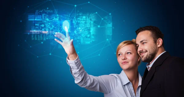 Man and woman accessing hologram with fingerprint — Stock Photo, Image