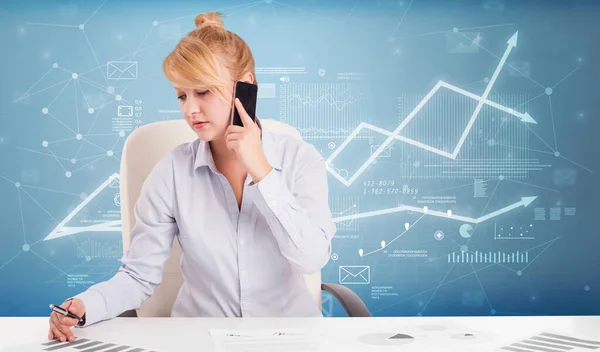 Business person sitting at desk with financial change concept — Stock Photo, Image