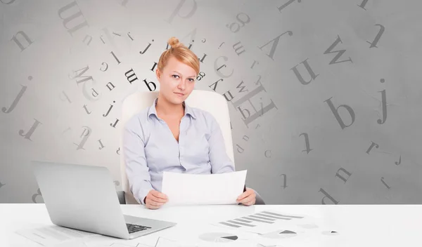 Business person sitting at desk with editorial concept — Stock Photo, Image