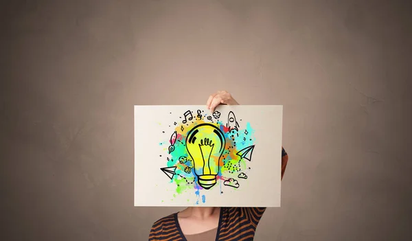Houder van een papier met kleurrijke lamp concept — Stockfoto
